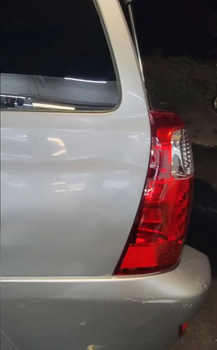 After: Crushed quarter panel on a silver Toyota 4Runner