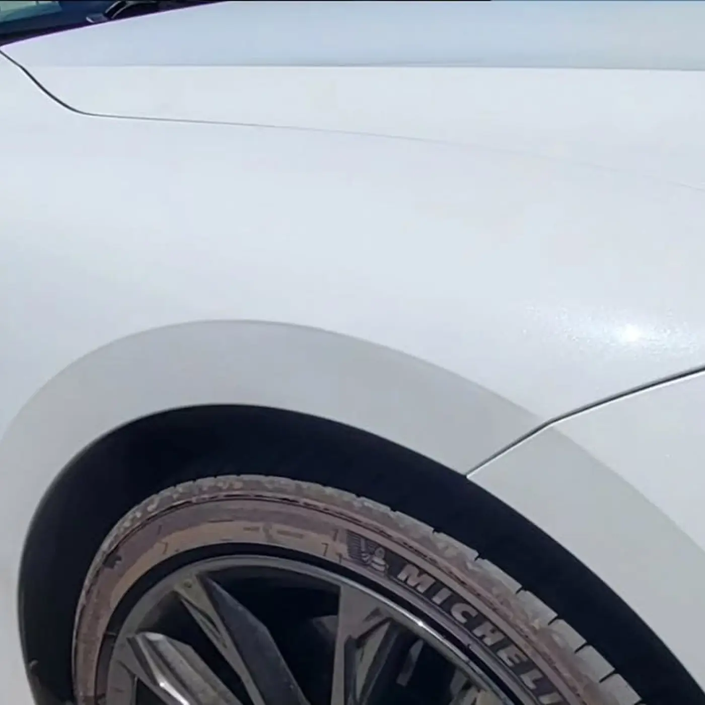 After: Creased front fender on a white Lexus